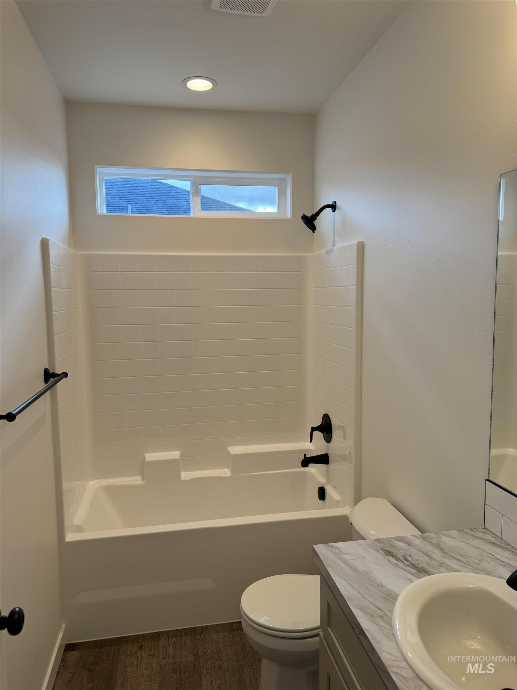 2008 Harrison Street South Twin Falls, ID 83301 - Photo 24 of 32 Full bath featuring vanity, shower / washtub combination, and dark wood-style floors