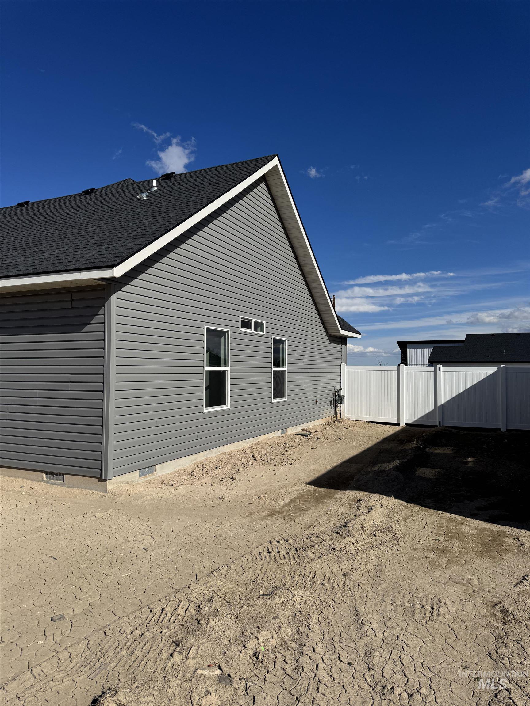 2008 Harrison Street South Twin Falls, ID 83301 - Photo 31 of 32 View of side of home featuring a fenced backyard and a shingled roof