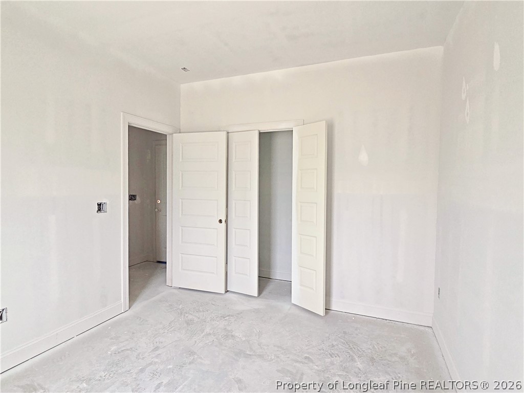 2650 Norrington Road Lillington, NC 27546 - Photo 9 of 24 an empty room with closet