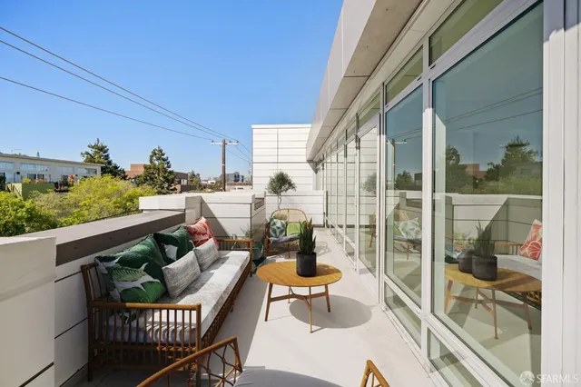 a view of an empty room with glass door