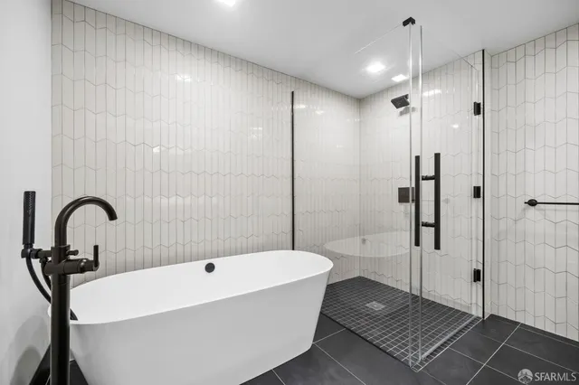 a front view of a building with a garden