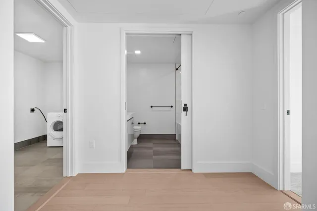 a lobby with furniture and floor to ceiling window