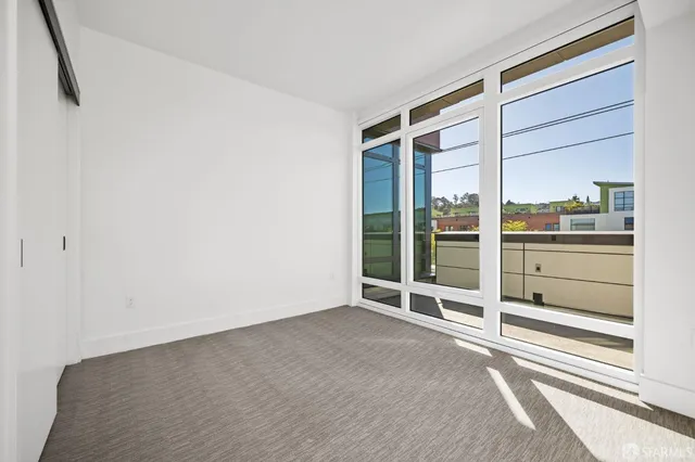 a view of a livingroom with furniture and chandelier