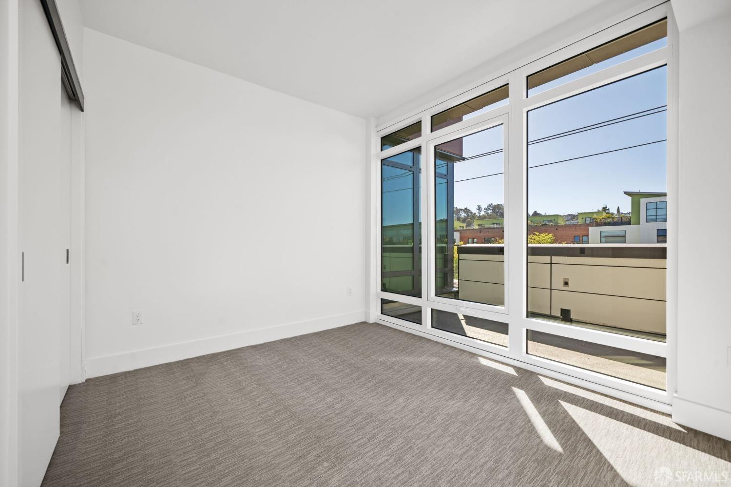 950 Tennessee Street, Unit 404 San Francisco, CA 94107 - Photo 27 of 80 a view of an empty room with glass door
