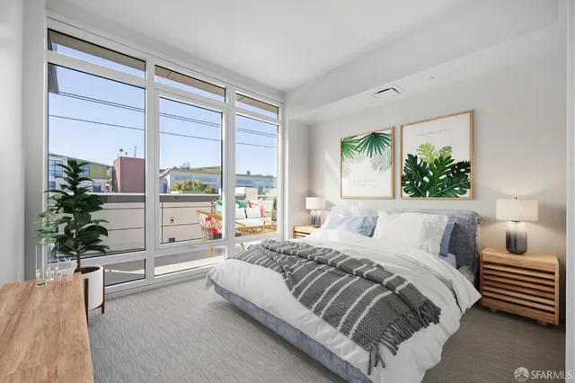 a view of multiple house with potted plants