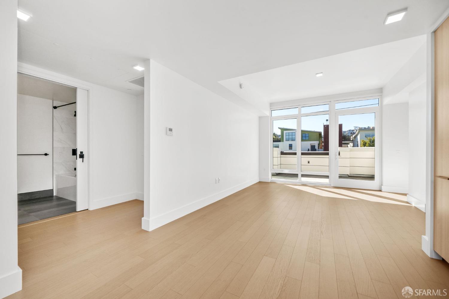 950 Tennessee Street, Unit 404 San Francisco, CA 94107 - Photo 3 of 80 wooden floor in an empty room with a window