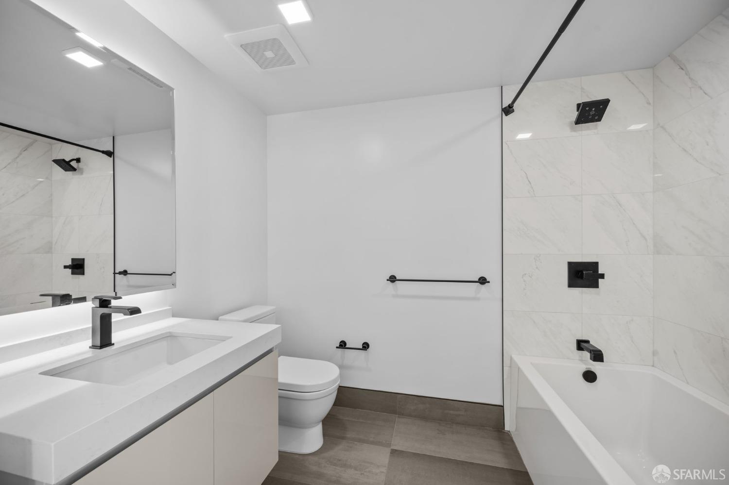 950 Tennessee Street, Unit 404 San Francisco, CA 94107 - Photo 31 of 80 a bathroom with a sink a toilet and shower