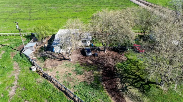 a backyard of a house with lots of green space