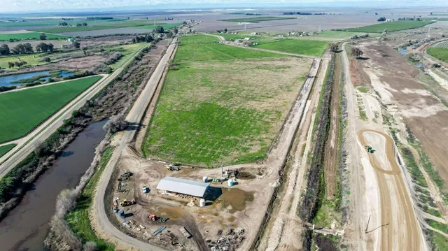 an aerial view of a residential houses with outdoor space