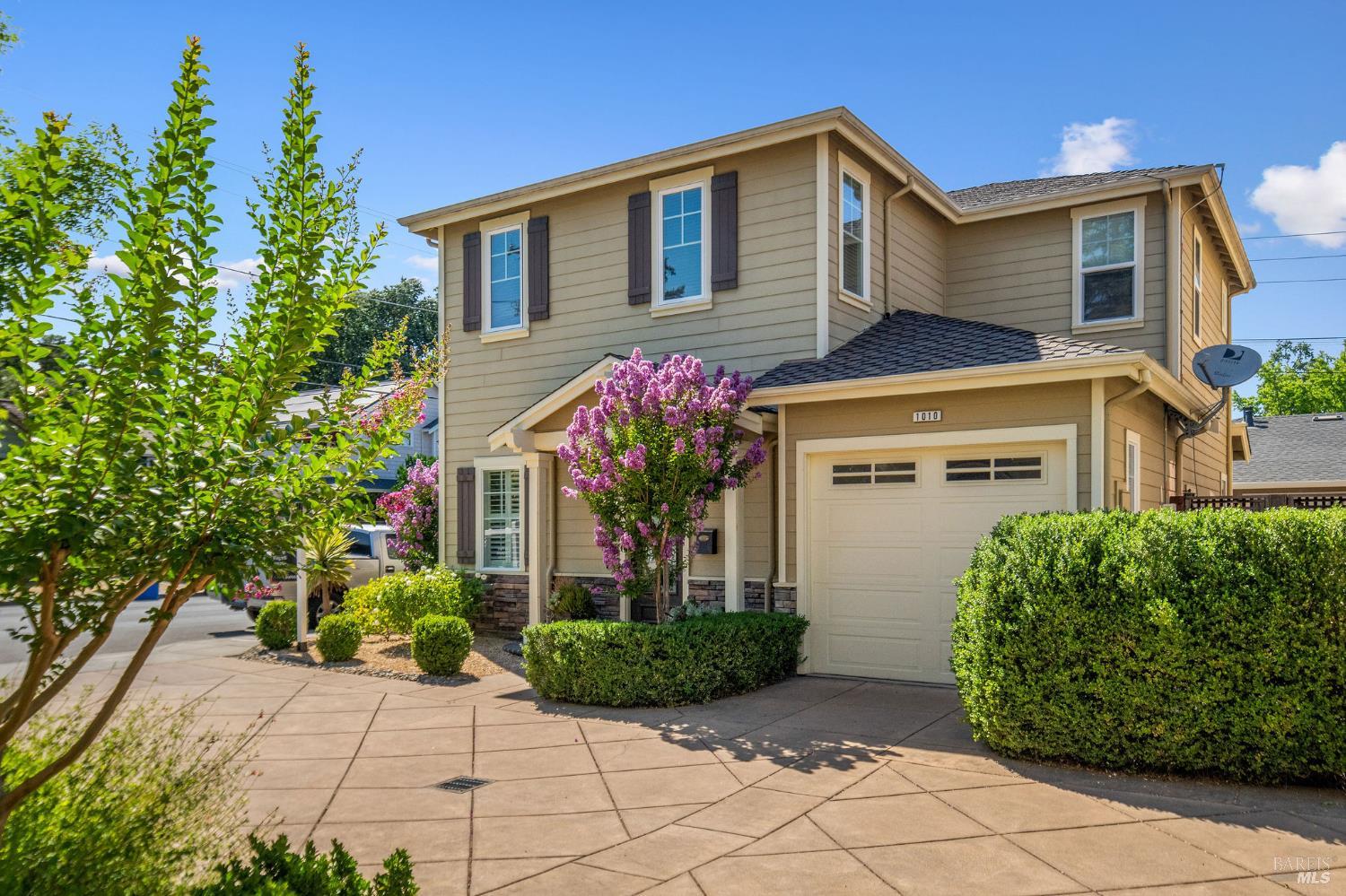 a front view of a house with garden