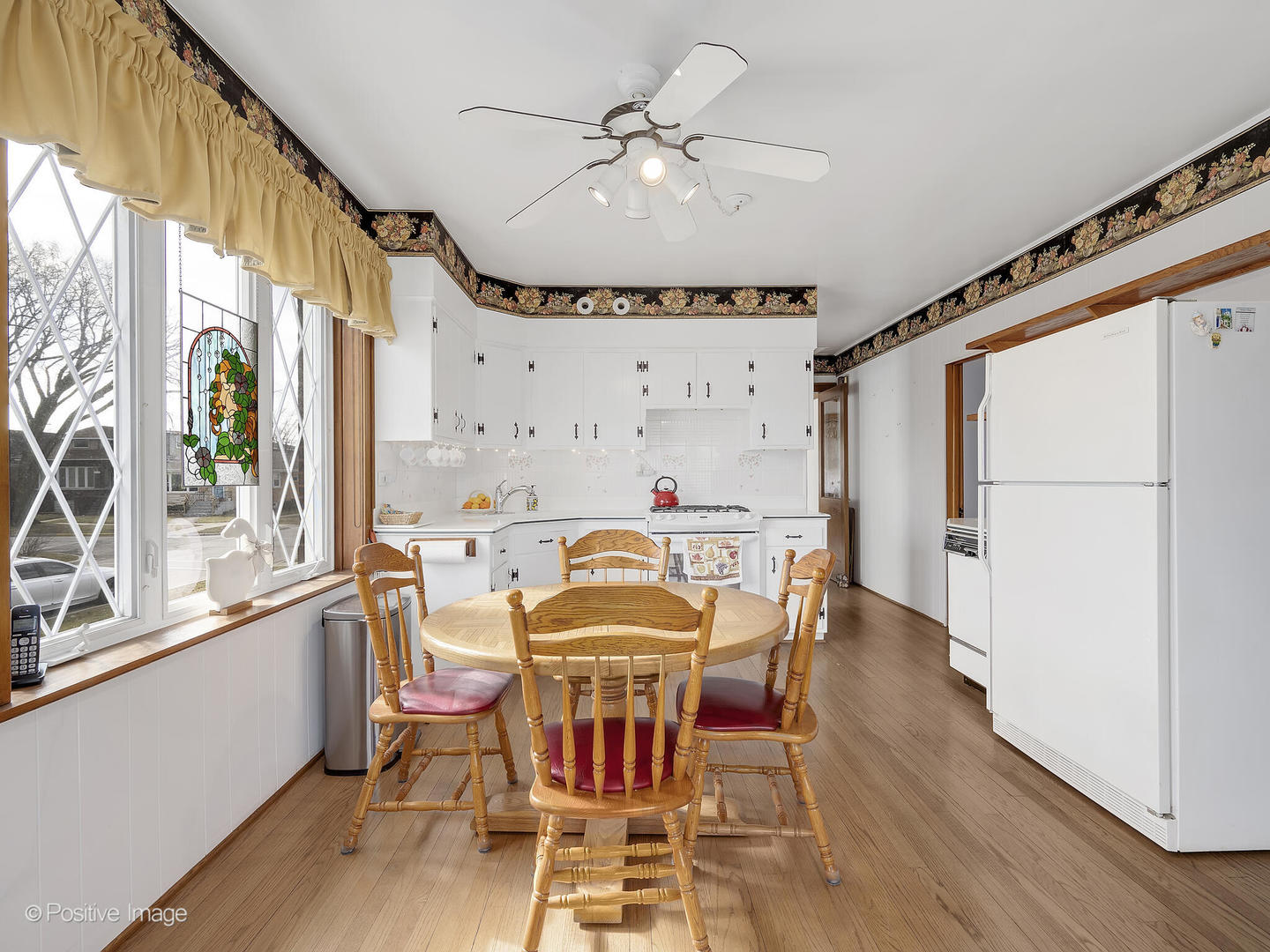 2435 Keystone Avenue North Riverside, IL 60546 - Photo 12 of 27 a view of a dining room with furniture window and wooden floor