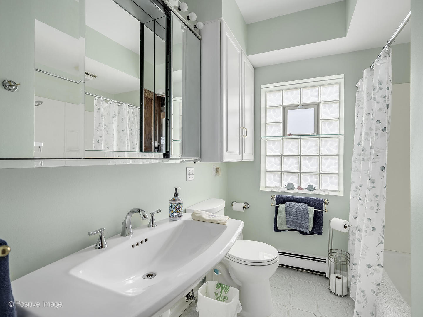2435 Keystone Avenue North Riverside, IL 60546 - Photo 22 of 27 a bathroom with a sink a toilet and mirror