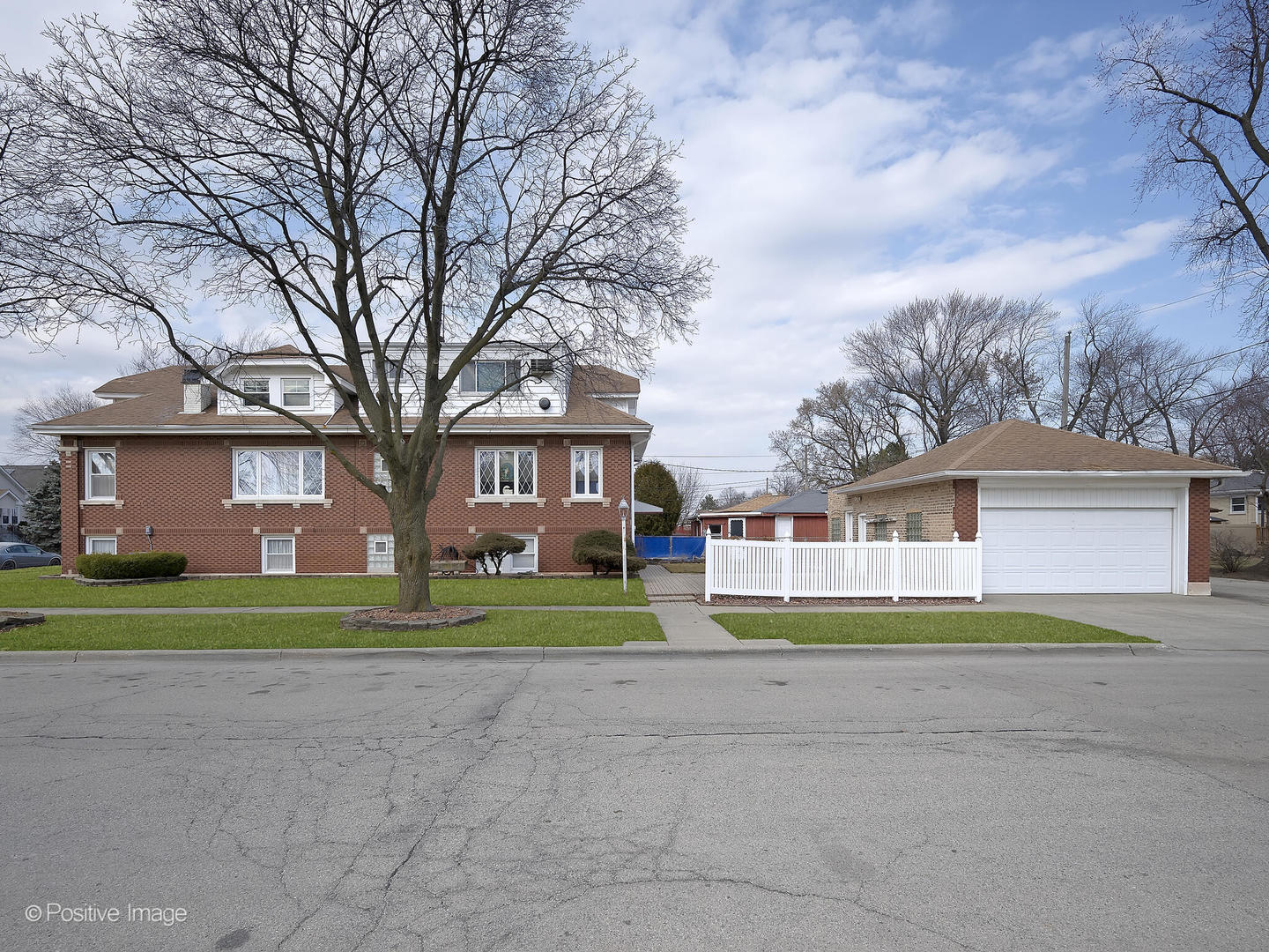 2435 Keystone Avenue North Riverside, IL 60546 - Photo 4 of 27 a front view of house with trees and big trees