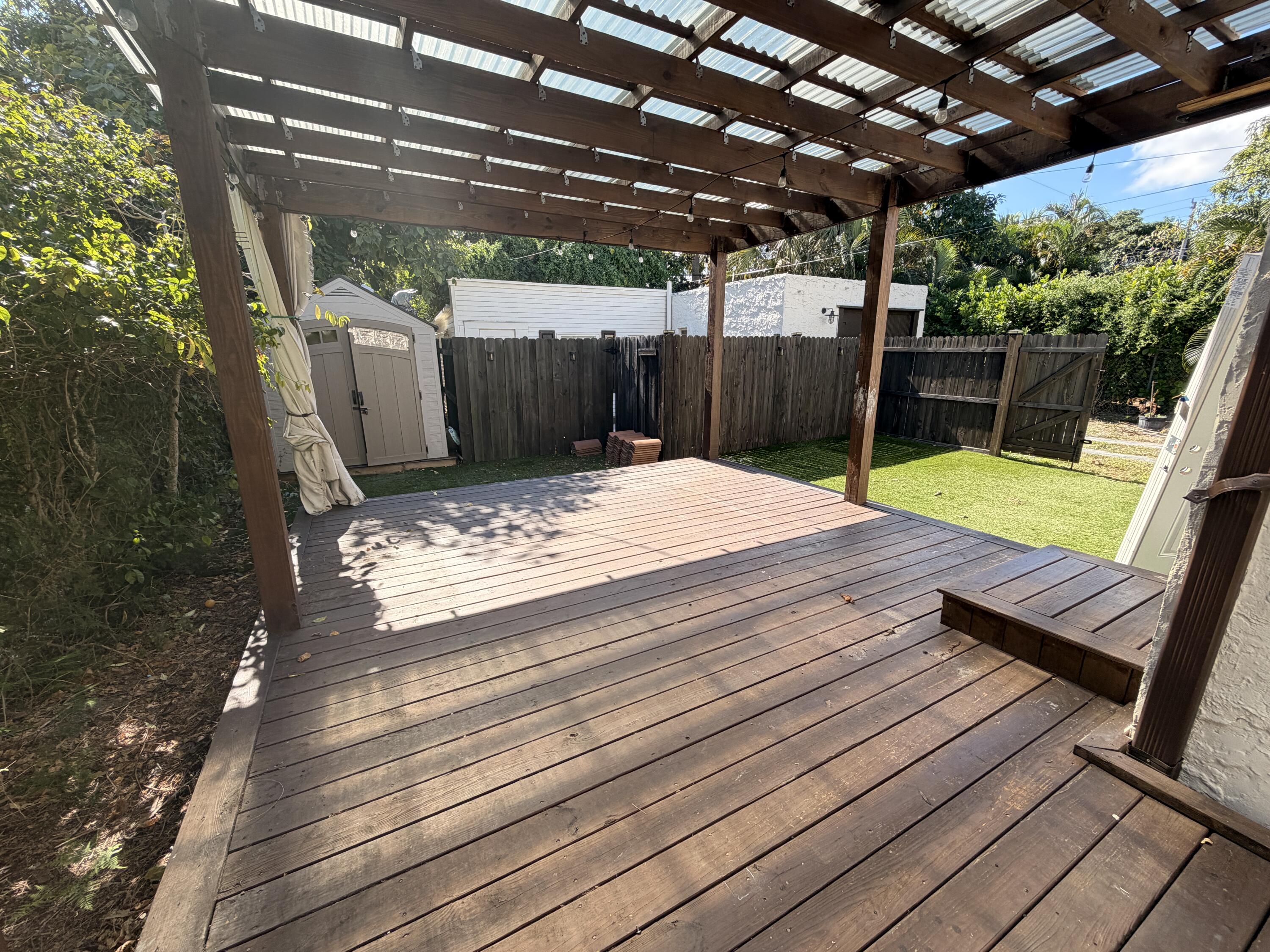 1026 Upland Road, Unit MAIN HOUSE West Palm Beach, FL 33401 - Photo 2 of 11 a view of a wooden deck