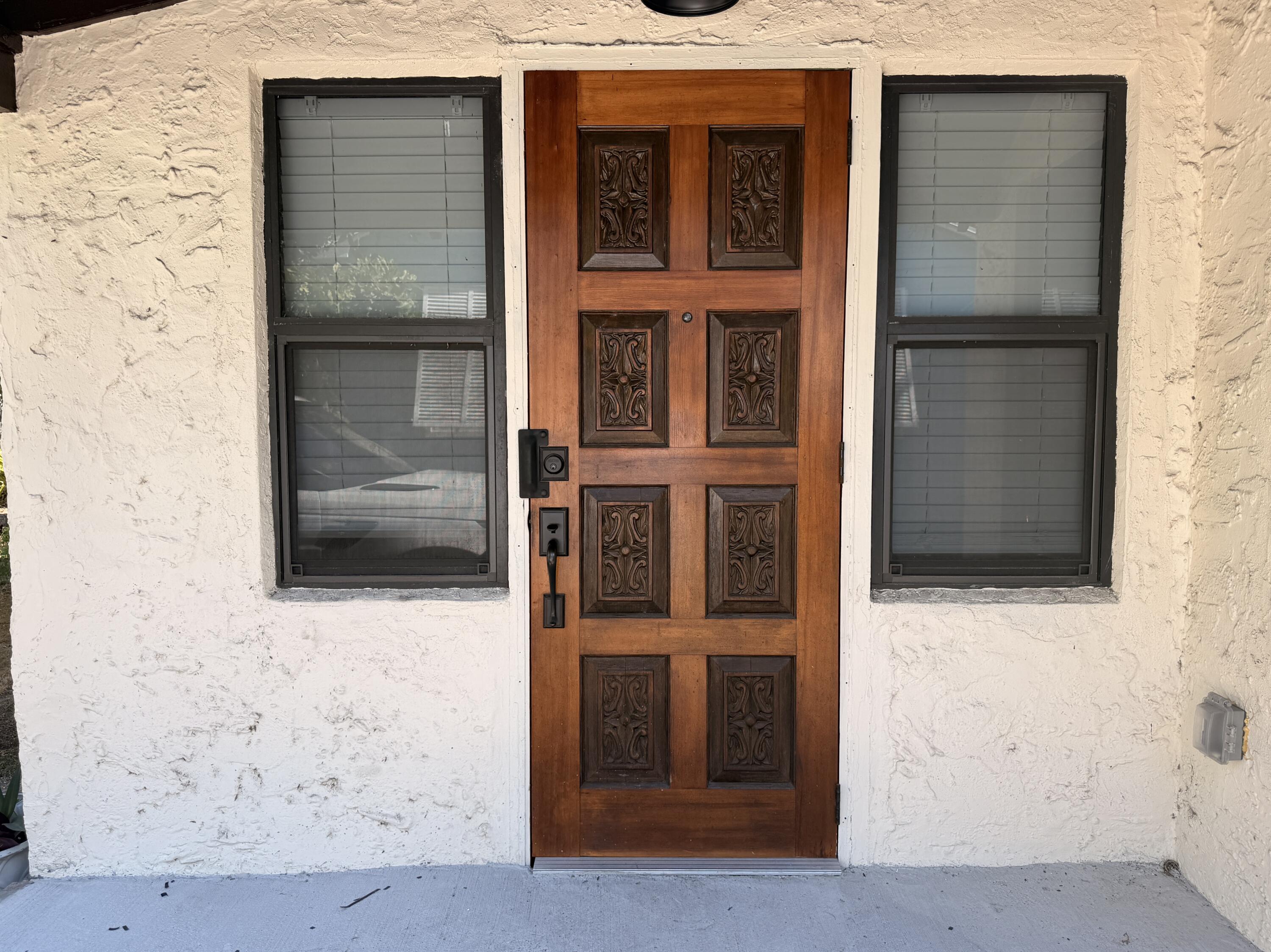 1026 Upland Road, Unit MAIN HOUSE West Palm Beach, FL 33401 - Photo 3 of 11 a front view of a house with a window