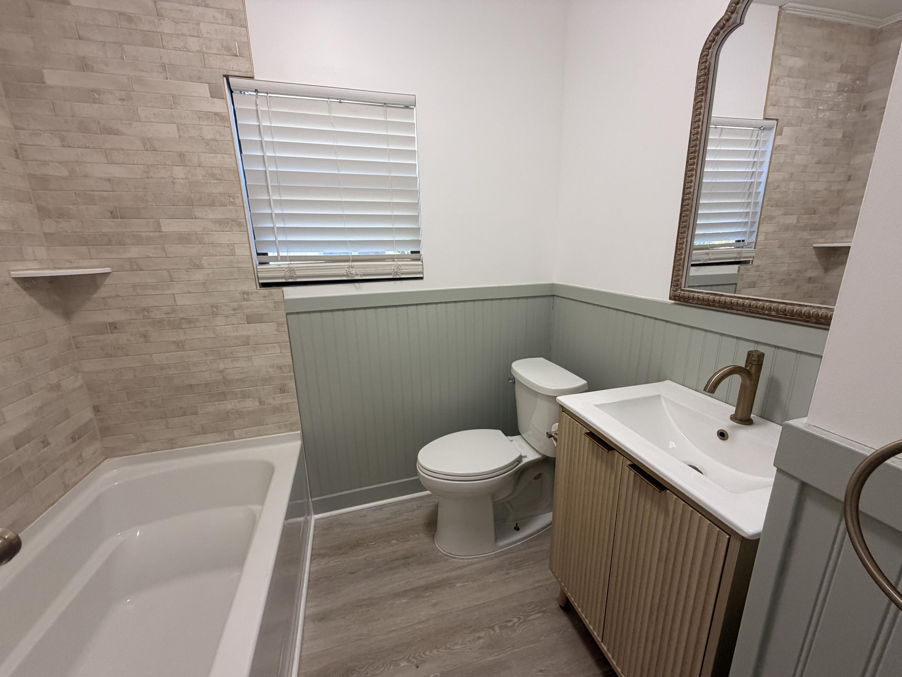 1026 Upland Road, Unit MAIN HOUSE West Palm Beach, FL 33401 - Photo 7 of 11 a bathroom with a sink and a toilet