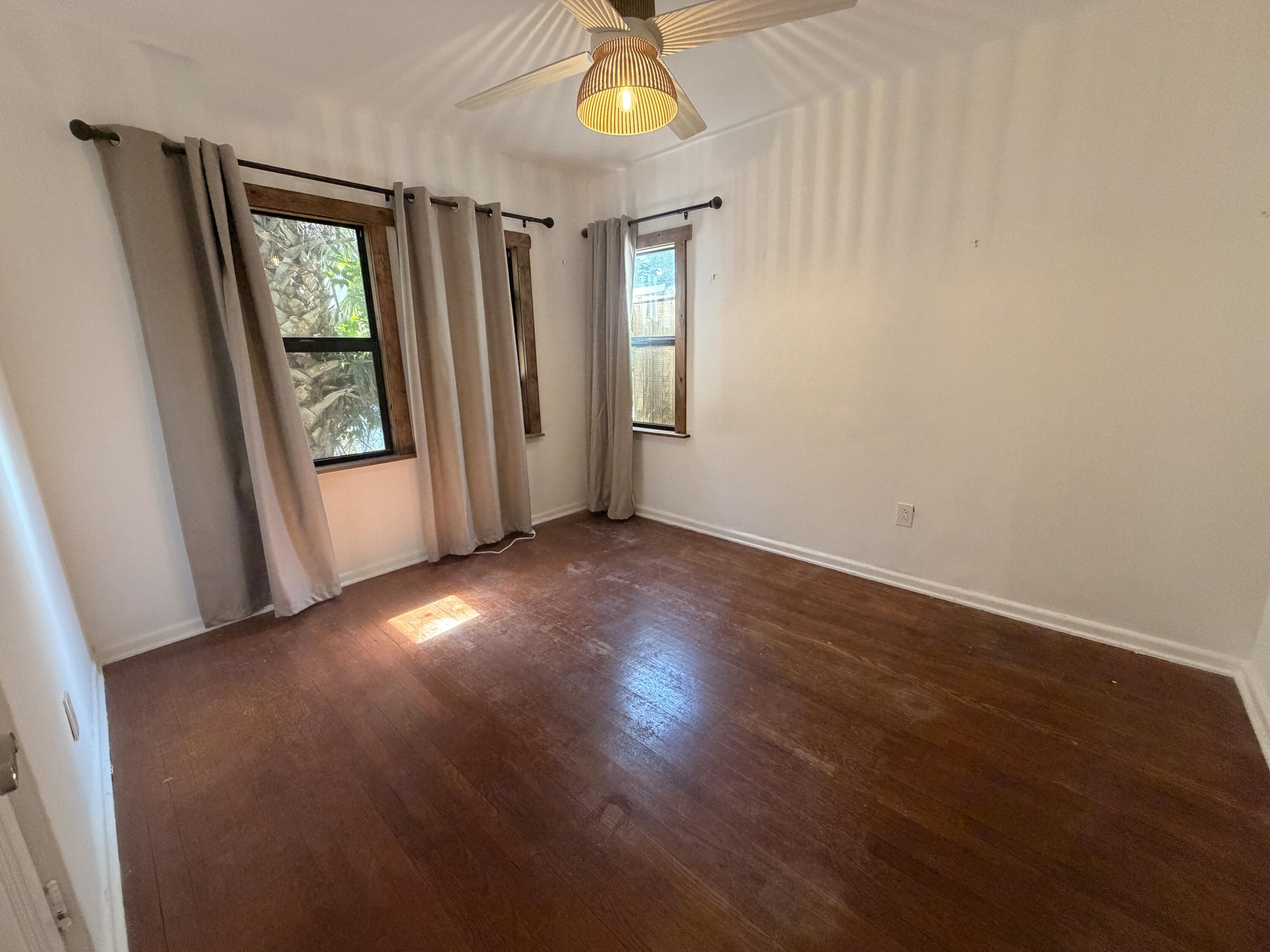 1026 Upland Road, Unit MAIN HOUSE West Palm Beach, FL 33401 - Photo 9 of 11 an empty room with windows and entrance