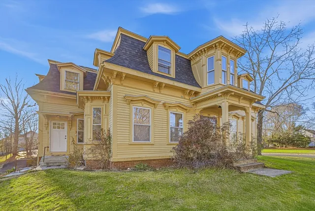 a front view of a house with garden
