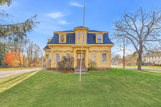 a front view of a house with a yard