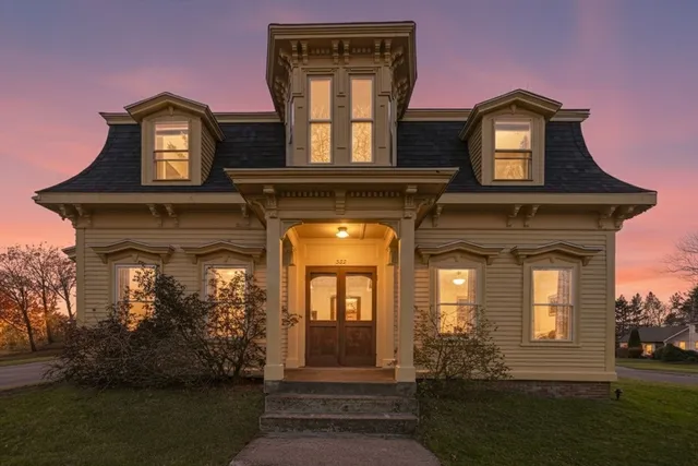 a front view of a house with garden