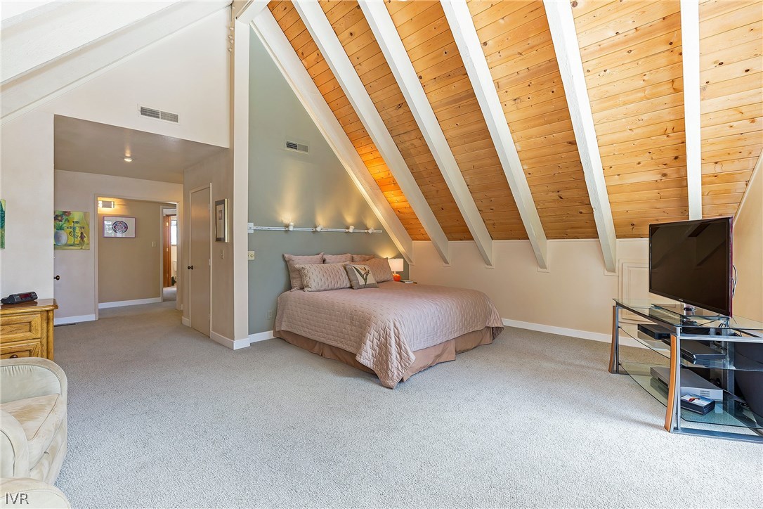 999 Apollo Way Incline Village, NV 89451 - Photo 11 of 33 a bedroom with a bed and a flat screen tv