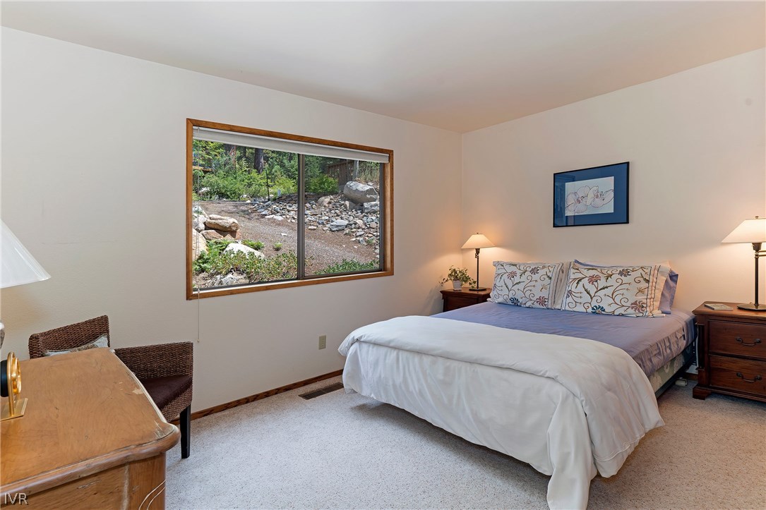 999 Apollo Way Incline Village, NV 89451 - Photo 16 of 33 a bedroom with a bed and a window