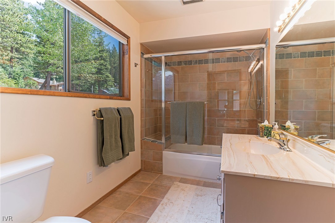 999 Apollo Way Incline Village, NV 89451 - Photo 19 of 33 a bathroom with a sink a toilet and a bathtub