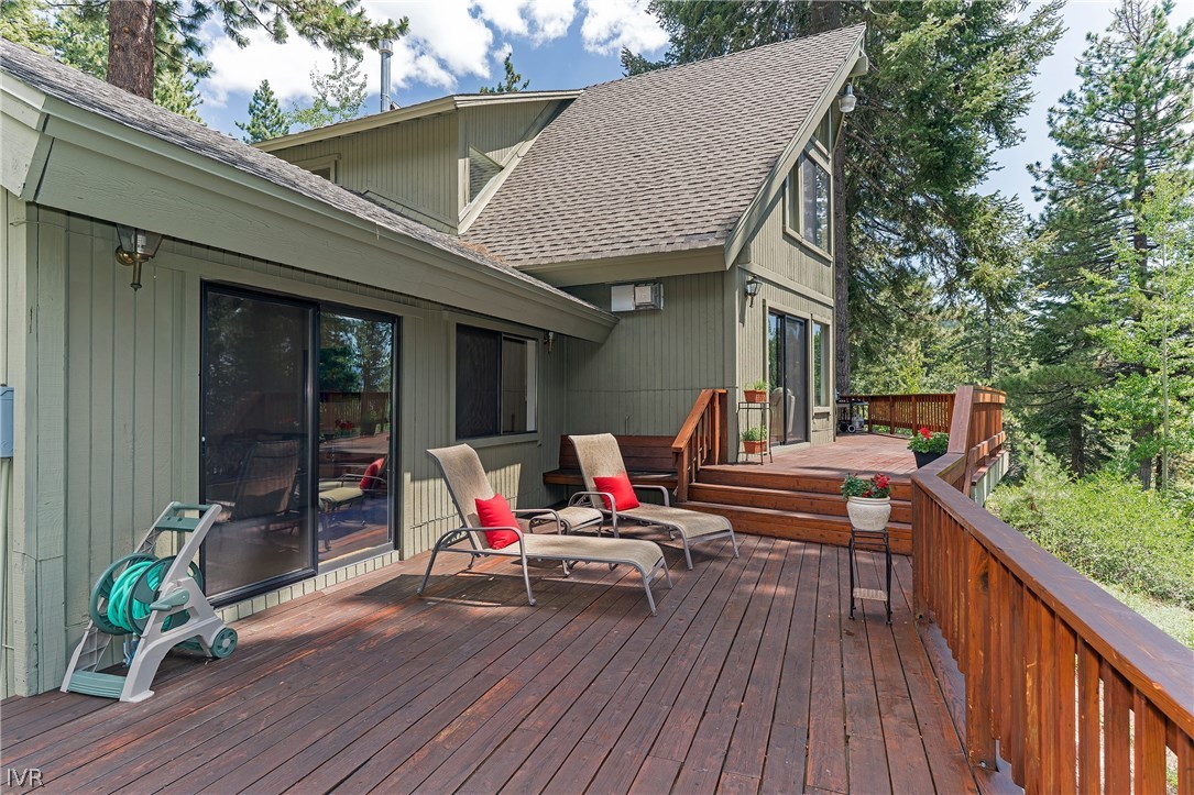 999 Apollo Way Incline Village, NV 89451 - Photo 23 of 33 a balcony with wooden floor table and chairs