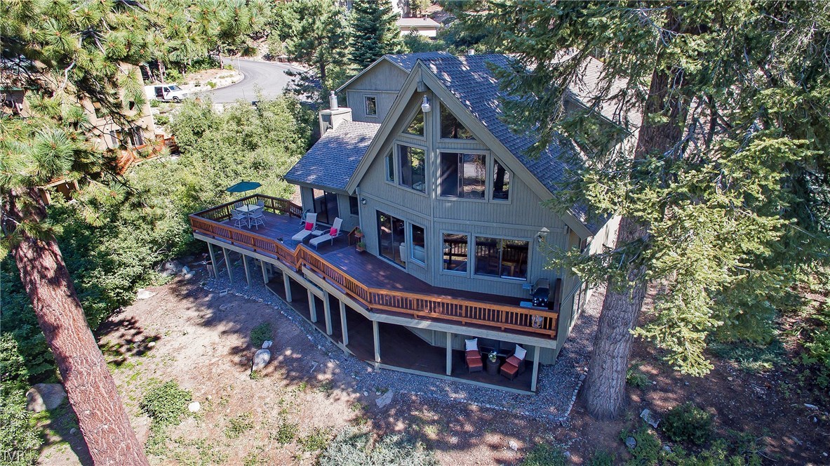 999 Apollo Way Incline Village, NV 89451 - Photo 32 of 33 a view of a house with a yard deck and a forest