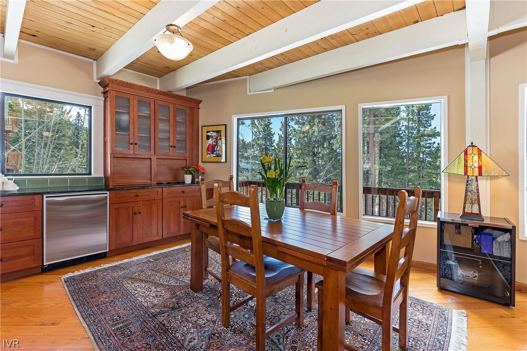 999 Apollo Way Incline Village, NV 89451 - Photo 6 of 33 a dining room with furniture large windows and wooden floor