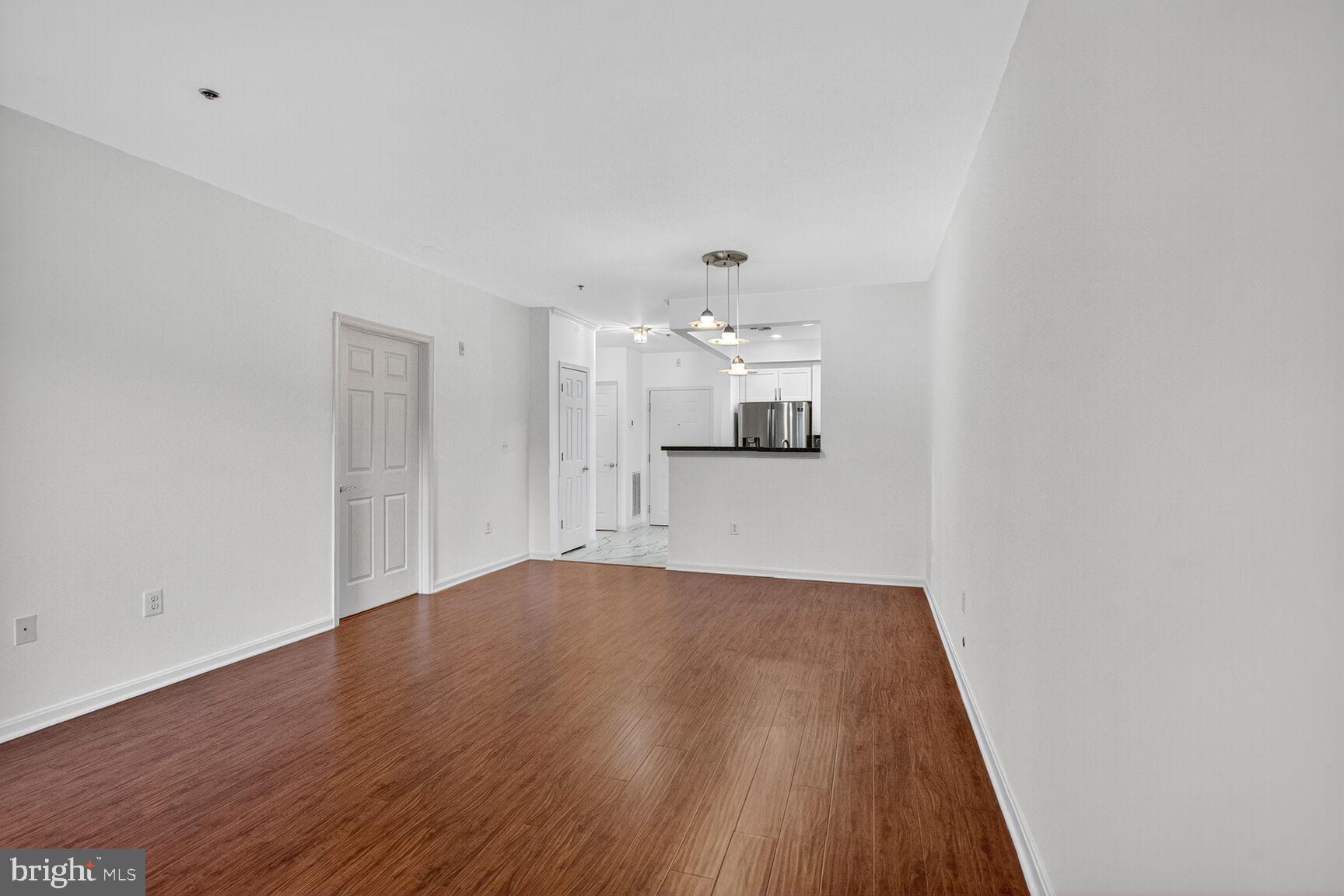 11775 Stratford House Place, Unit 206 Reston, VA 20190 - Photo 14 of 39 a view of empty room with wooden floor