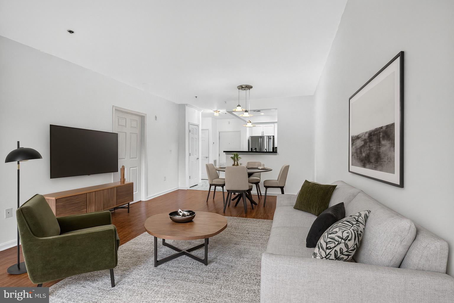 11775 Stratford House Place, Unit 206 Reston, VA 20190 - Photo 15 of 39 a living room with furniture and a flat screen tv