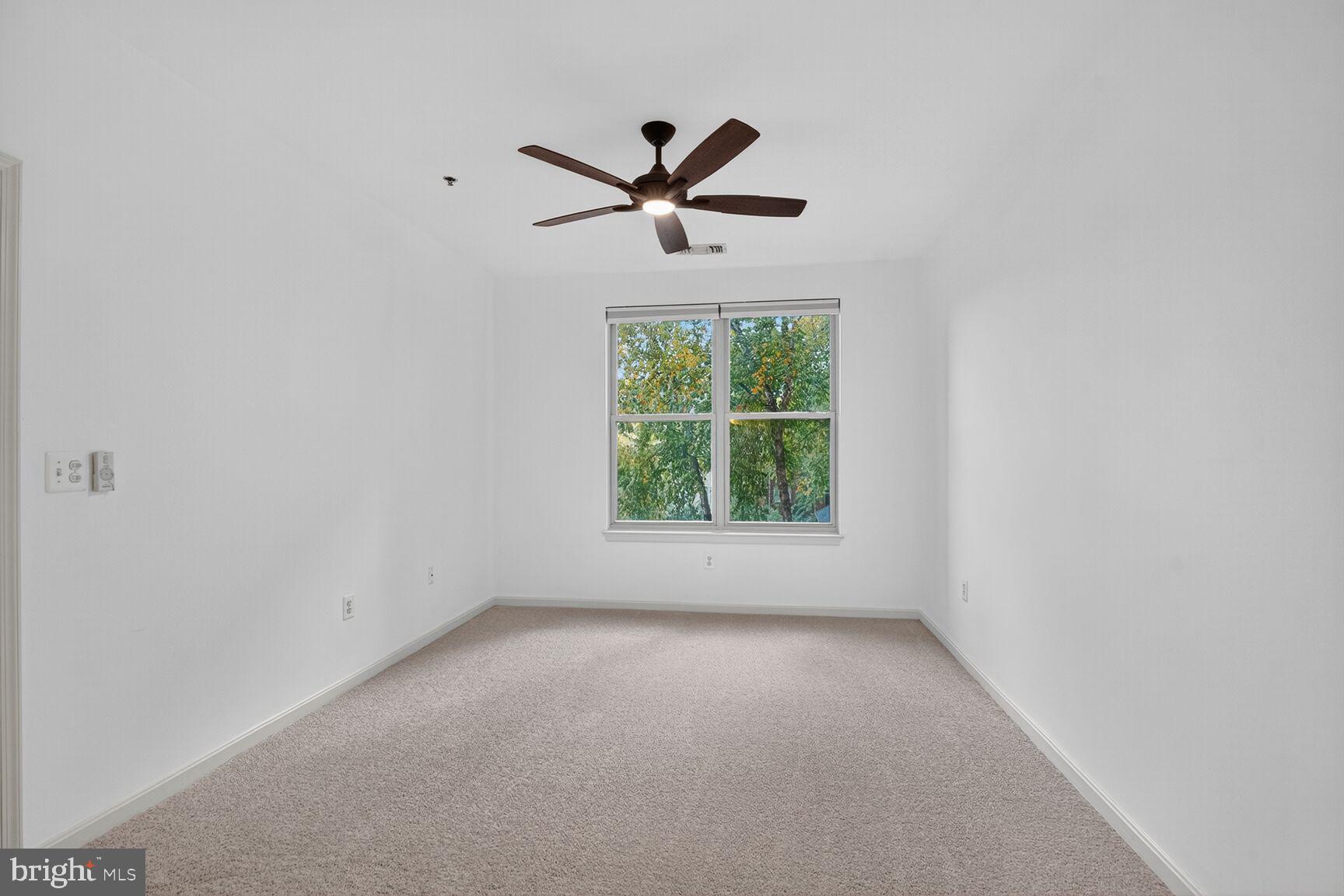 11775 Stratford House Place, Unit 206 Reston, VA 20190 - Photo 16 of 39 a view of room with window and a ceiling fan
