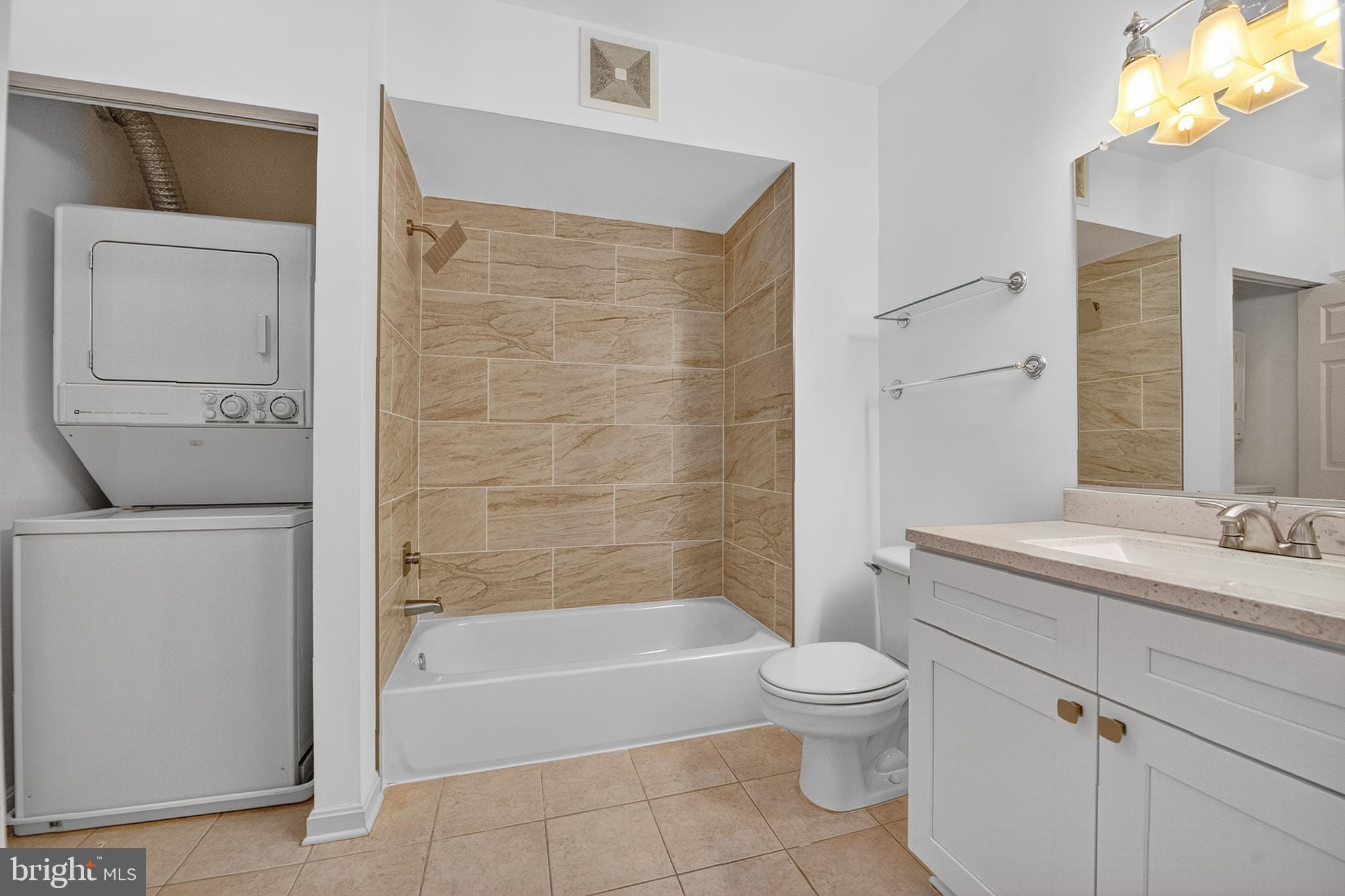 11775 Stratford House Place, Unit 206 Reston, VA 20190 - Photo 19 of 39 a bathroom with a granite countertop sink toilet and shower