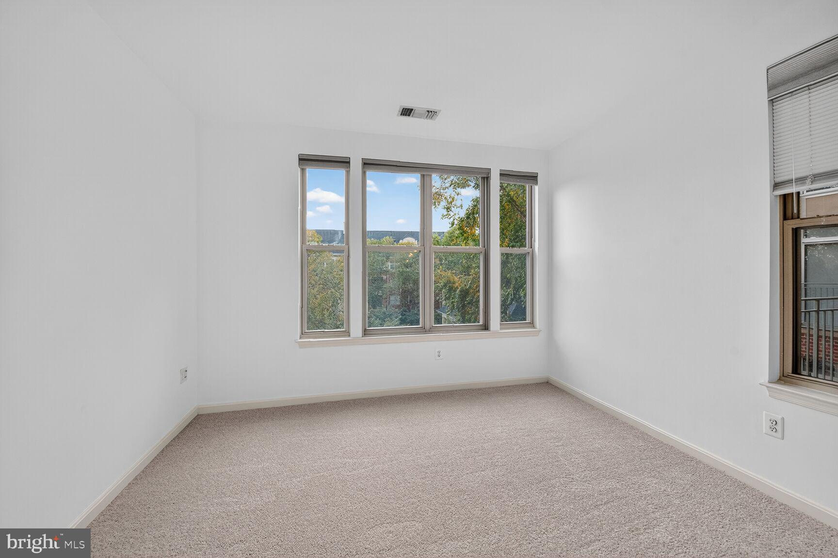 11775 Stratford House Place, Unit 206 Reston, VA 20190 - Photo 20 of 39 an empty room with a window