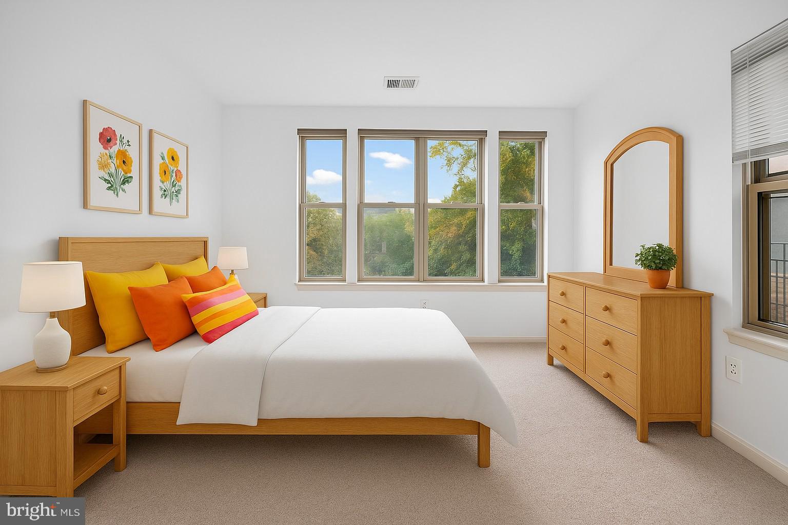 11775 Stratford House Place, Unit 206 Reston, VA 20190 - Photo 21 of 39 a bedroom with furniture and windows