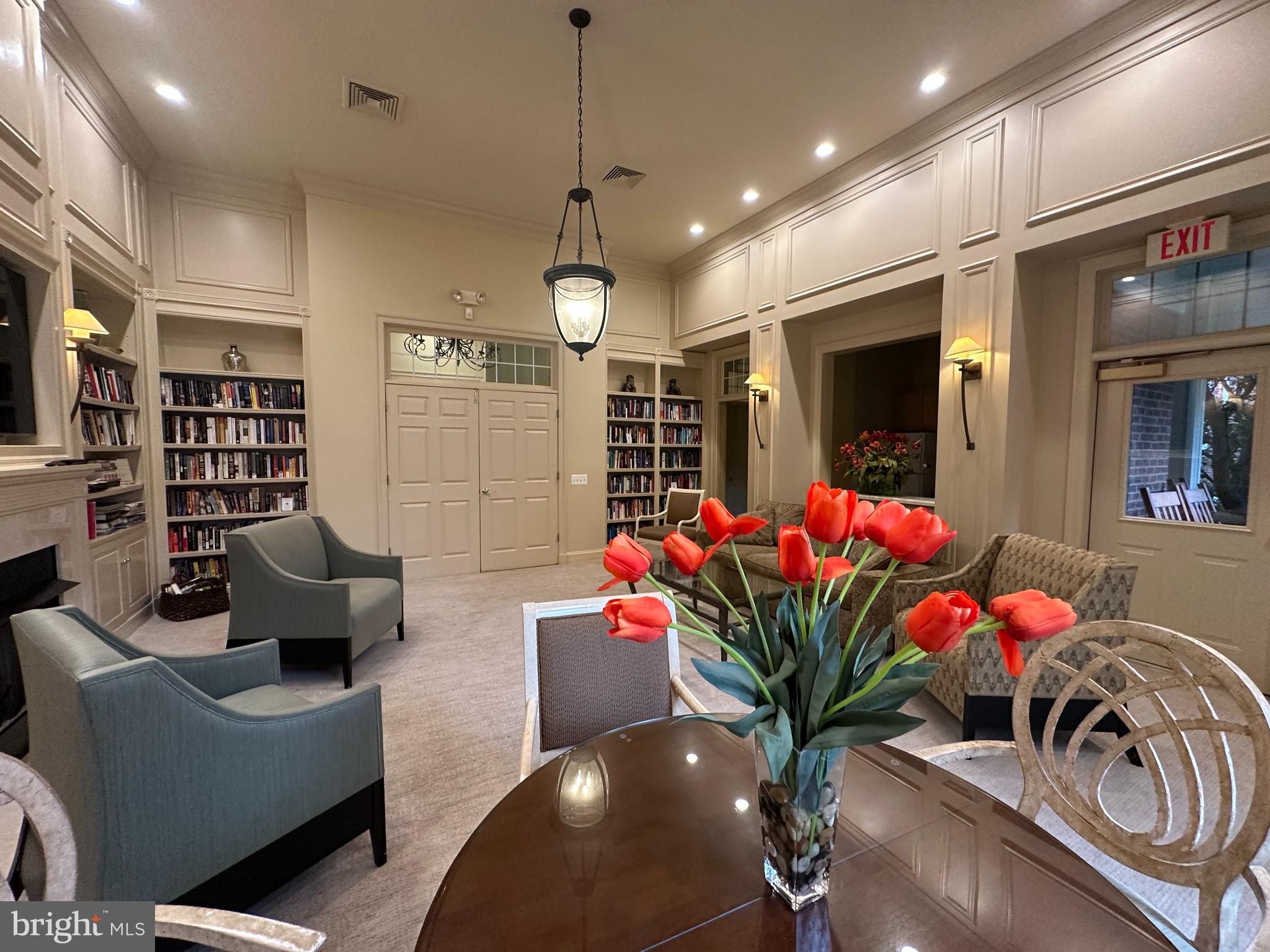 11775 Stratford House Place, Unit 206 Reston, VA 20190 - Photo 27 of 39 a living room with furniture and flowers