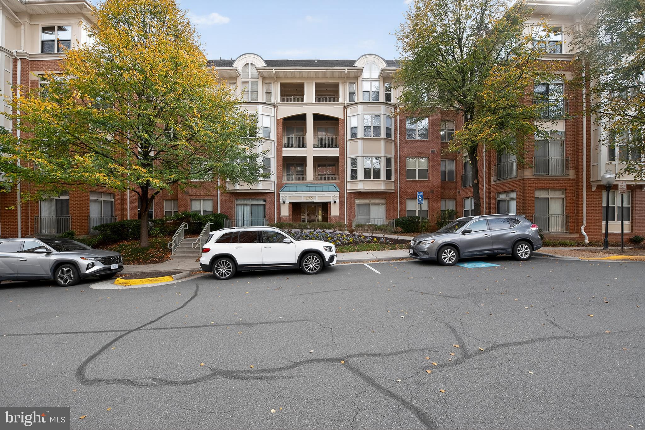 11775 Stratford House Place, Unit 206 Reston, VA 20190 - Photo 4 of 39 a car parked in front of a building
