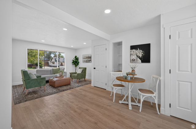 546 West 200 South Payson, UT 84651 - Photo 24 of 45 Open-concept living space featuring wood-finish flooring, recessed lighting, and a neutral color palette