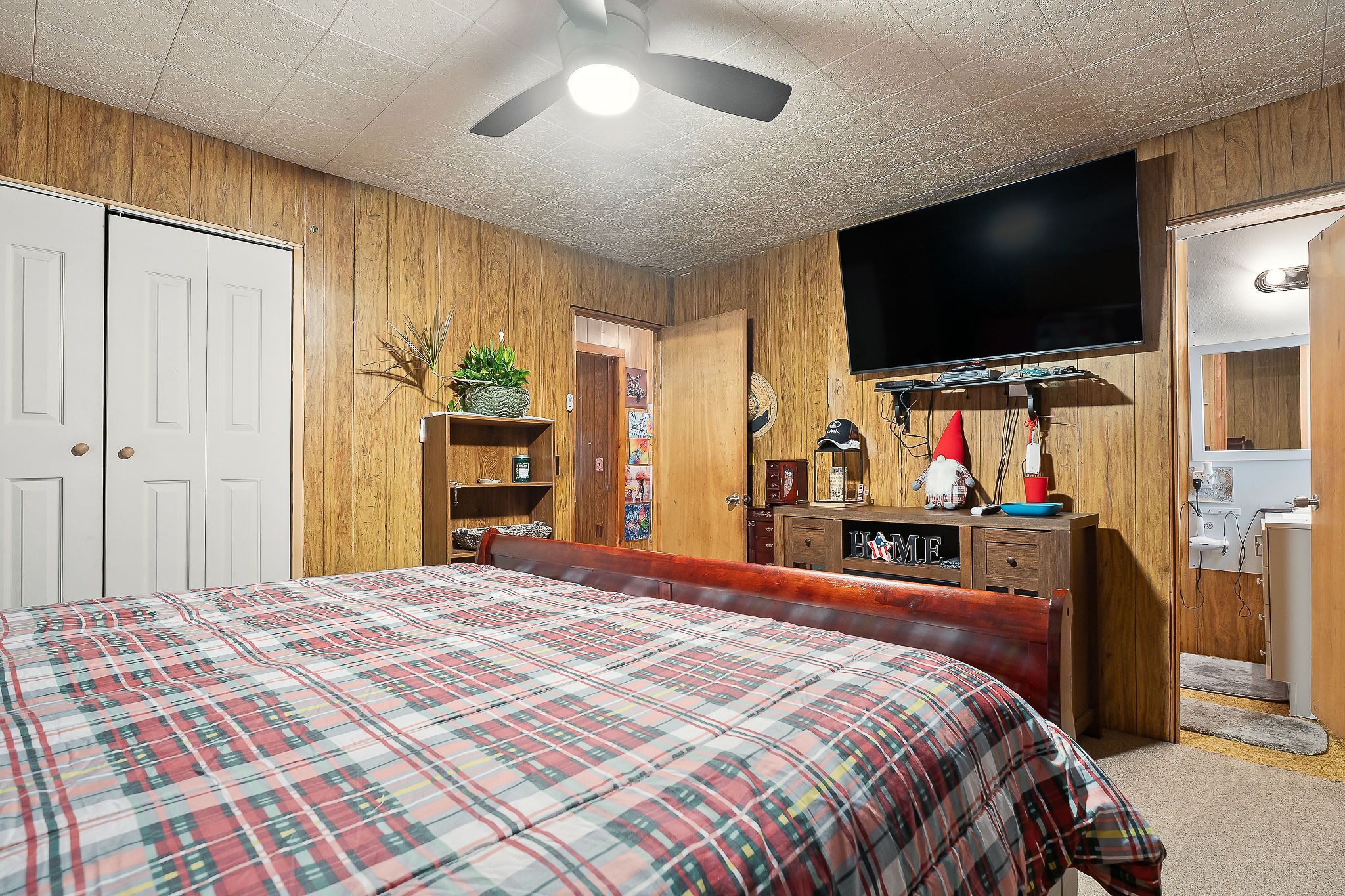 968 Boyd Road Rock Island, TN 38581 - Photo 12 of 42 a bedroom with a bed and a flat tv screen on dresser