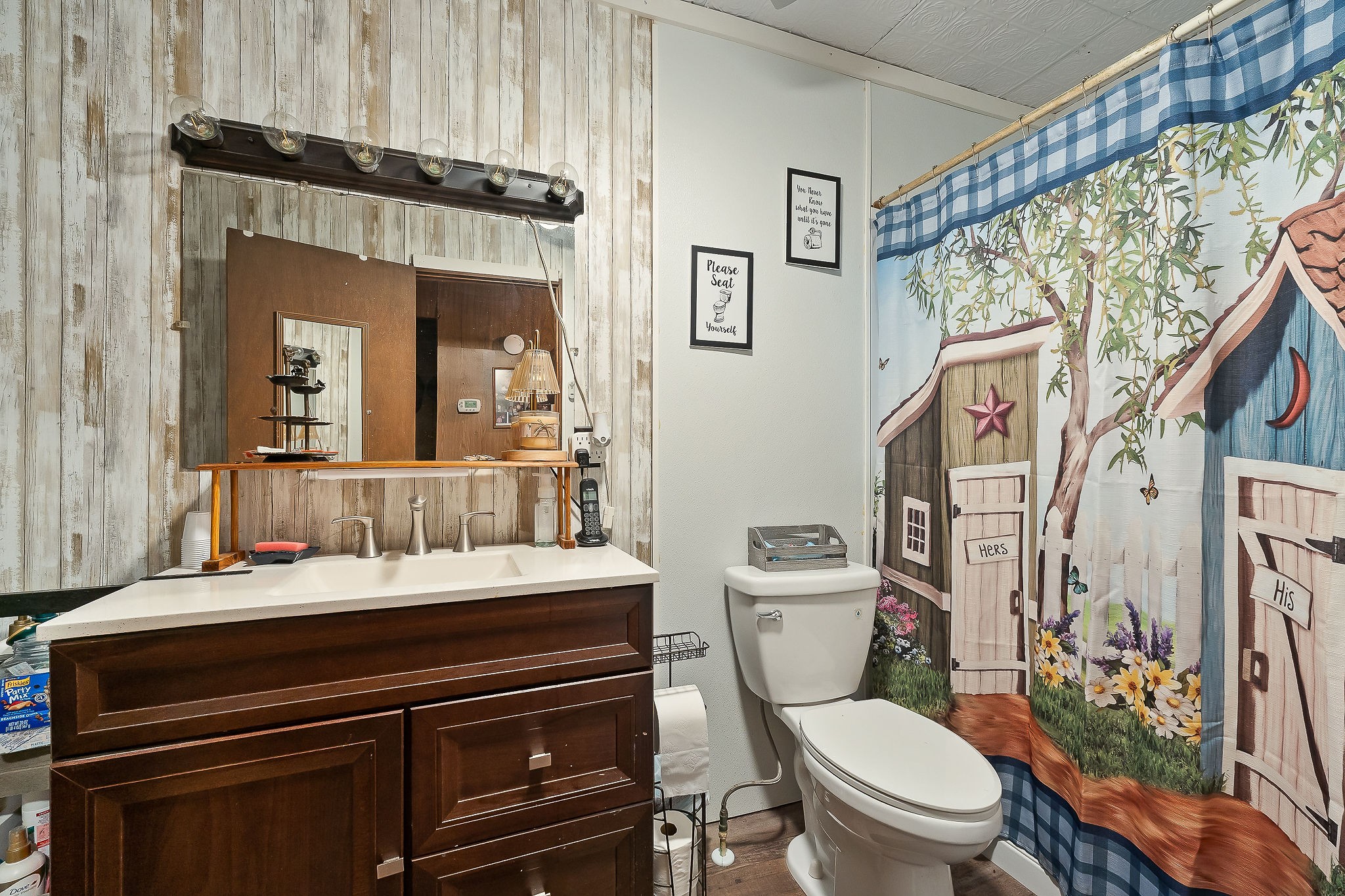 968 Boyd Road Rock Island, TN 38581 - Photo 14 of 42 a bathroom with a toilet a sink and a mirror