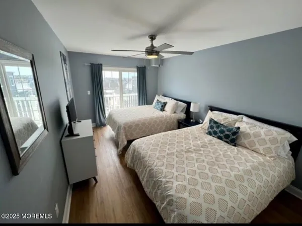 a bedroom with bed and window