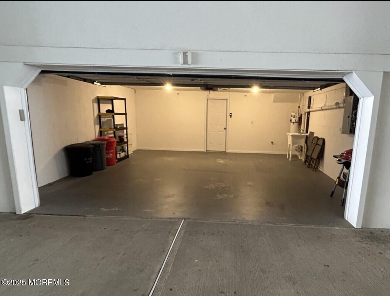 15 Sumner Avenue, Unit 11 Seaside Heights, NJ 08751 - Photo 13 of 13 a view of empty room with wooden floor and fan
