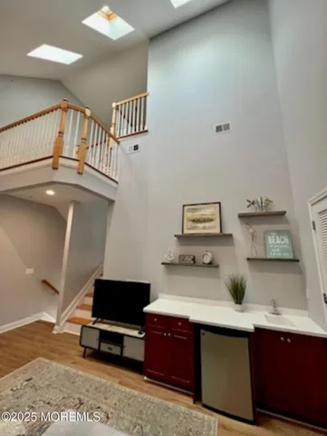 a view of workspace with a window and couch