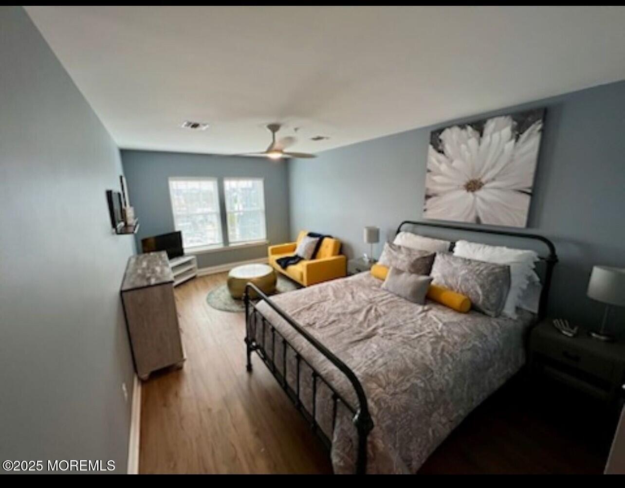 15 Sumner Avenue, Unit 11 Seaside Heights, NJ 08751 - Photo 9 of 13 a bedroom with bed and window