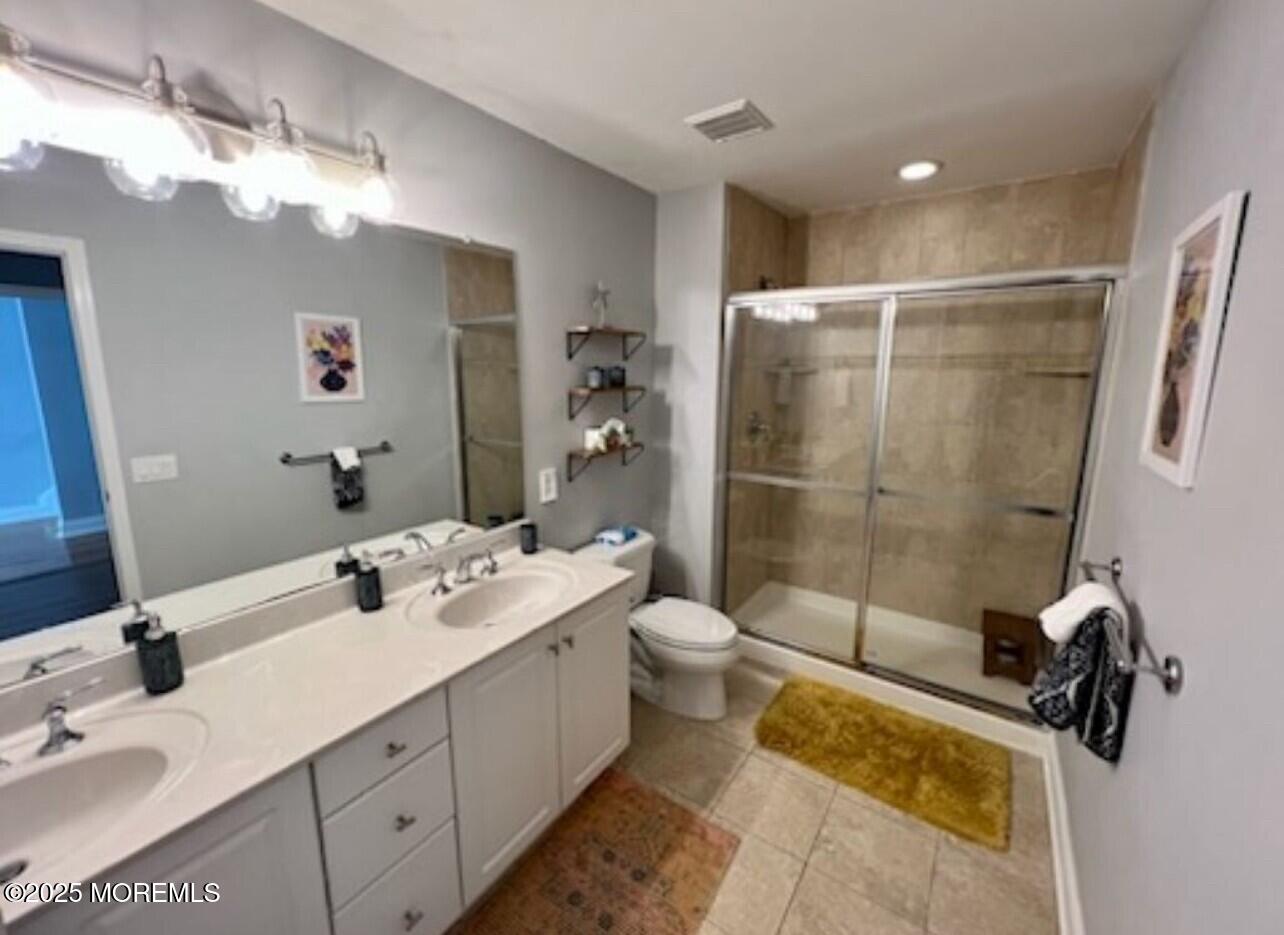 15 Sumner Avenue, Unit 11 Seaside Heights, NJ 08751 - Photo 10 of 13 a bathroom with a tub sink toilet and shower