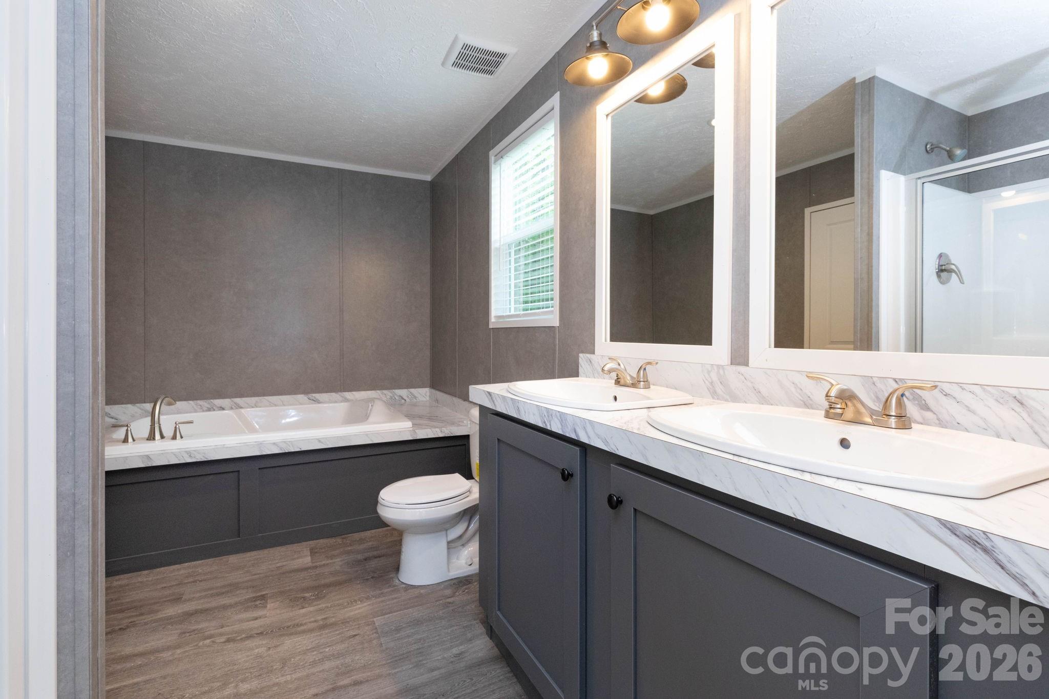 Tbd Bell Sprinkle Road Weaverville, NC 28787 - Photo 11 of 24 a bathroom with a double vanity sink toilet and a mirror