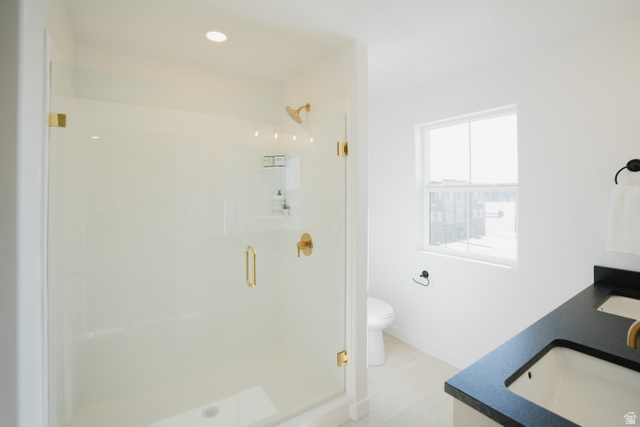 2012 West 1150 South, Unit 1018 Payson, UT 84651 - Photo 20 of 25 Full bath with double vanity, a stall shower, and recessed lighting