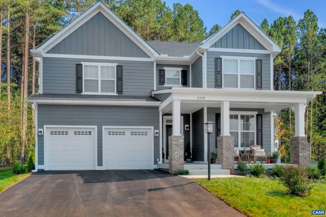 a view of a yard in front view of a house