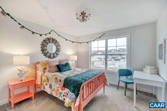 a bedroom with a bed and a table in it